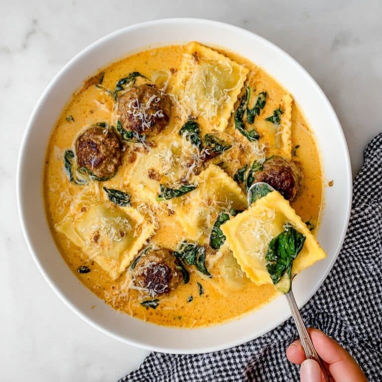 Ravioli Soup with Italian Sausage, Tomatoes, Spinach, and Basil Pesto Recipe